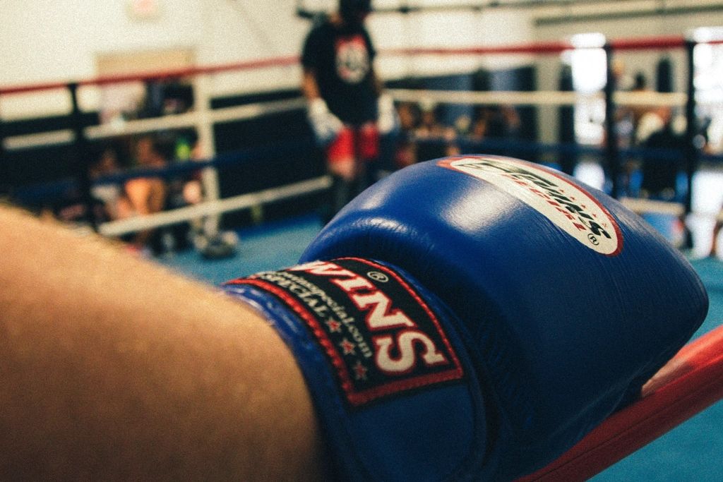 Close-up of a boxing glove by the ring in a martial arts club